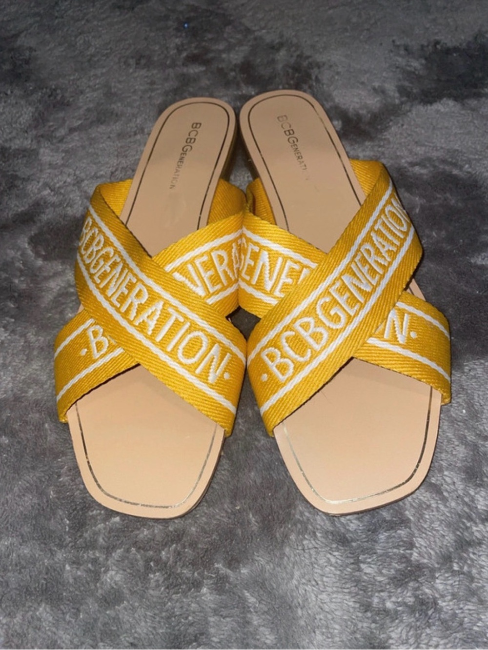 BCBGeneration Mustard Yellow Crisscross Logo Slide Mules